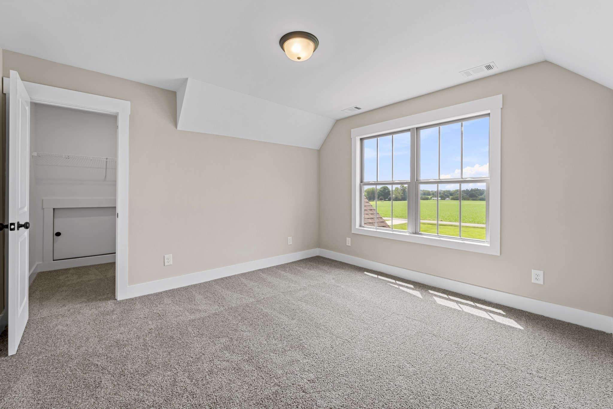 537 Clearview Road Cottontown, TN 37048 - Photo 11 of 15 an empty room with windows and cabinet