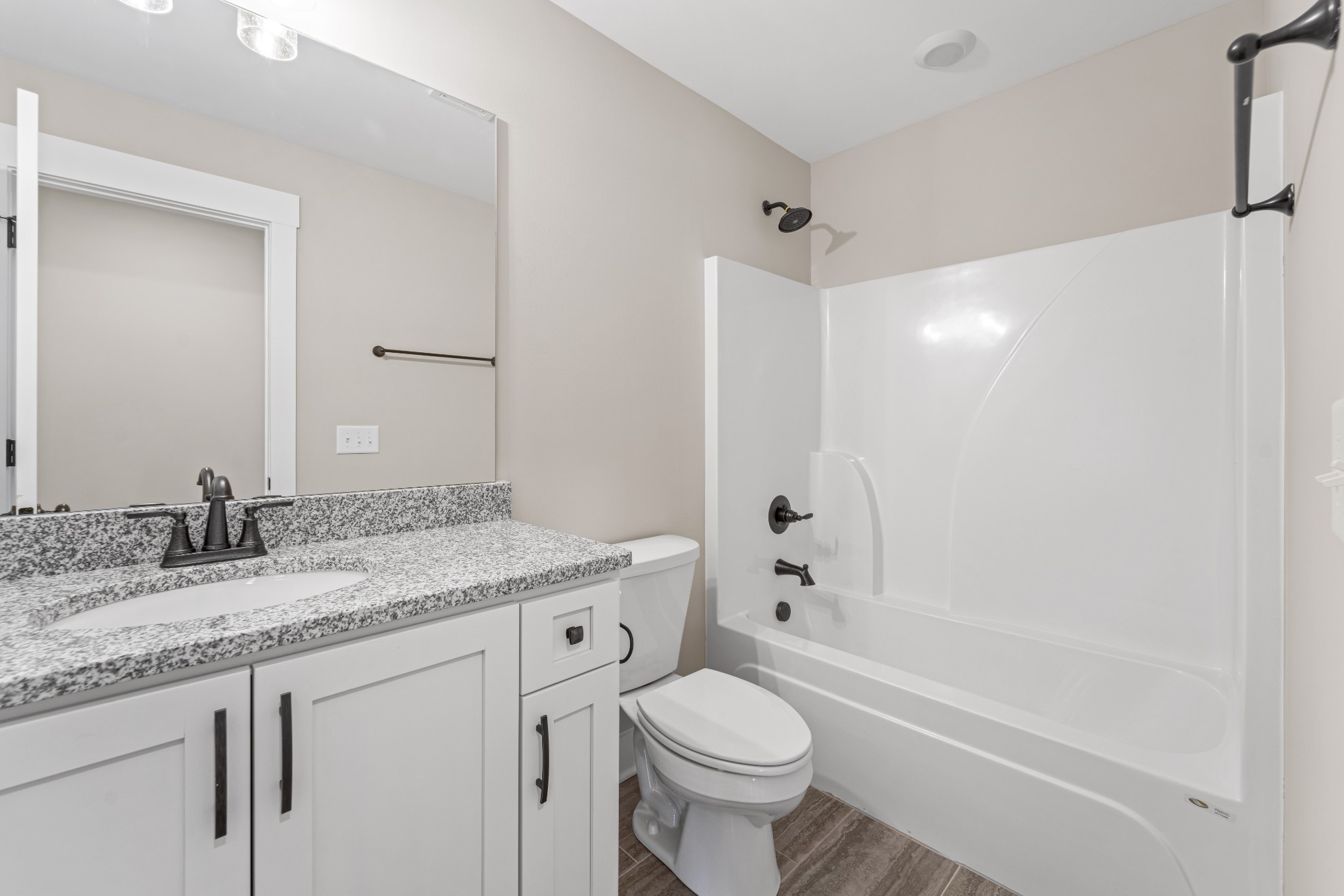 537 Clearview Road Cottontown, TN 37048 - Photo 12 of 15 a bathroom with a granite countertop toilet a sink and a bathtub