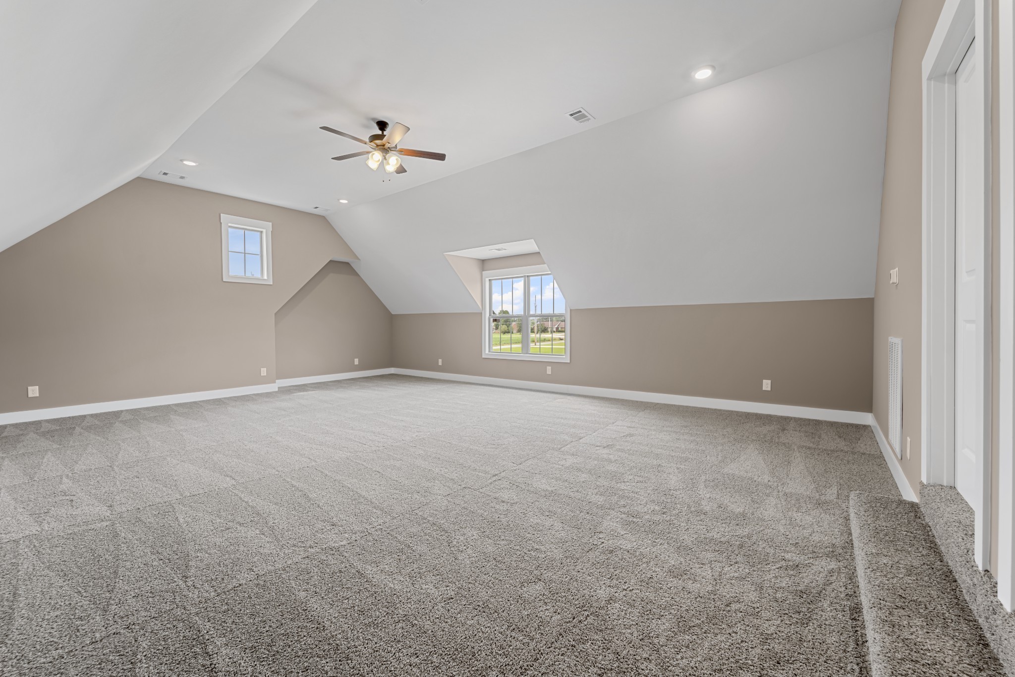 537 Clearview Road Cottontown, TN 37048 - Photo 14 of 15 an empty room with a ceiling fan and windows
