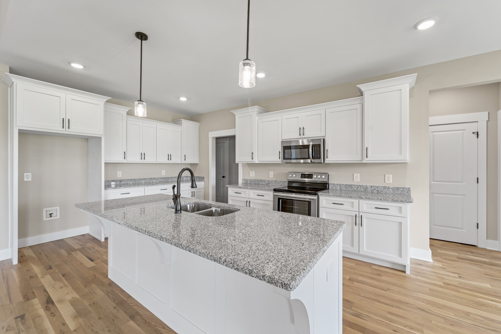 537 Clearview Road Cottontown, TN 37048 - Photo 2 of 15 a kitchen with stainless steel appliances granite countertop a sink refrigerator and cabinets