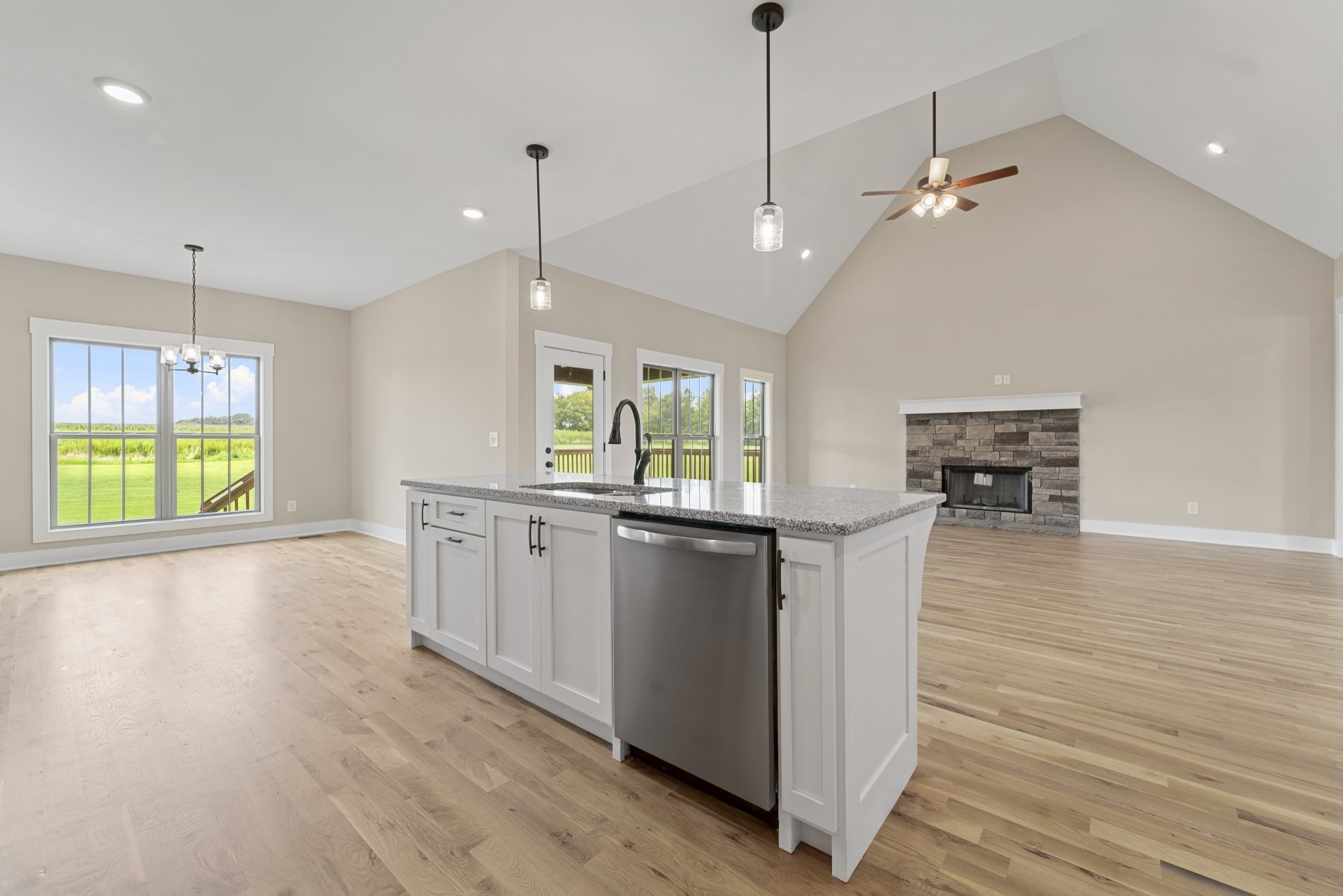 537 Clearview Road Cottontown, TN 37048 - Photo 5 of 15 a kitchen with kitchen island granite countertop a stove a sink a center island and wooden floor