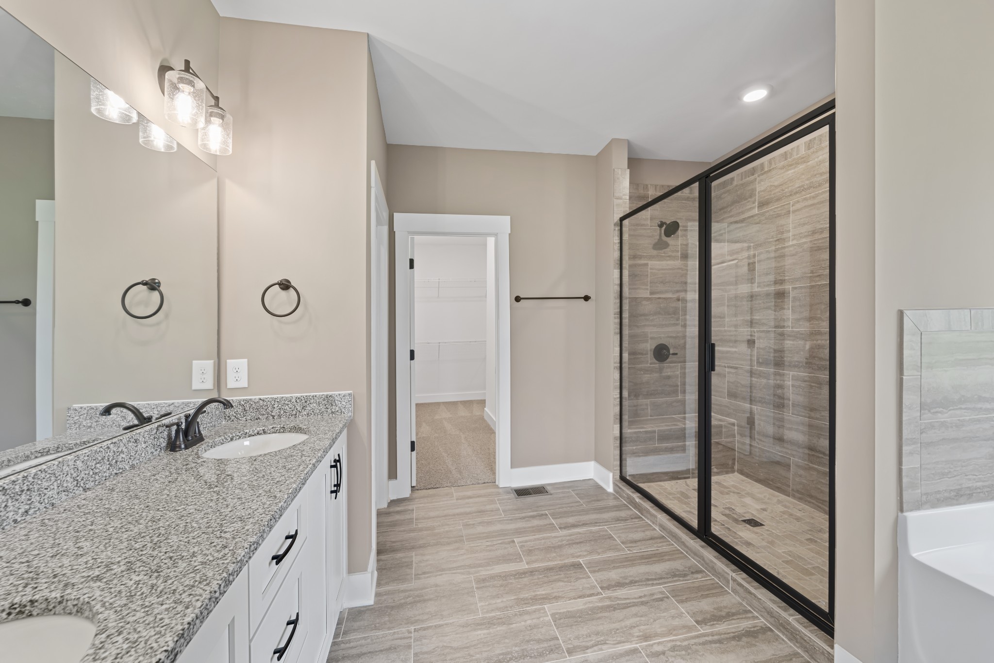 537 Clearview Road Cottontown, TN 37048 - Photo 9 of 15 a bathroom with a granite countertop sink mirror and shower