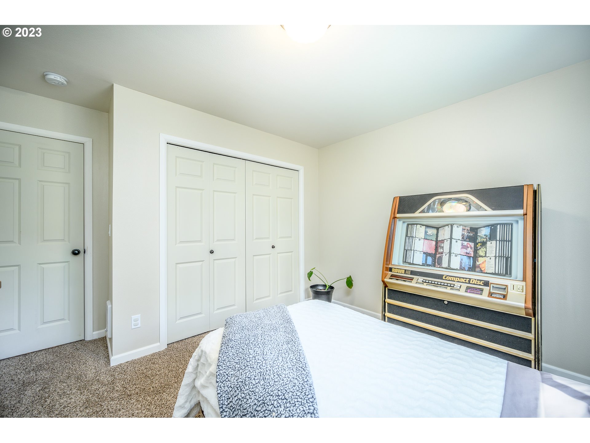 7297 Ash Street Grand Ronde, OR 97347 - Photo 21 of 33 a bedroom with a bed and a painting on the wall