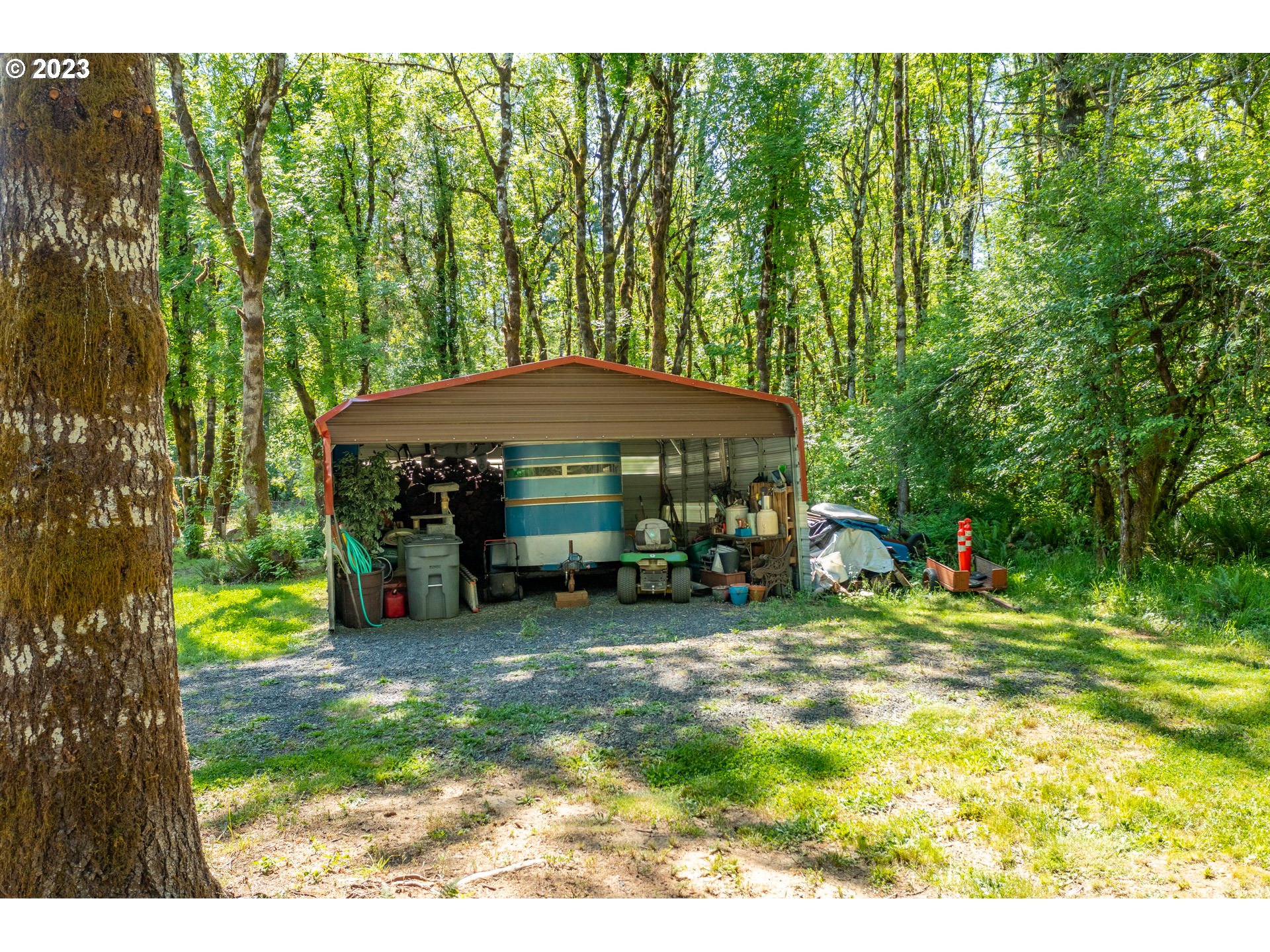 7297 Ash Street Grand Ronde, OR 97347 - Photo 31 of 33 a view of a park with large trees and a barn