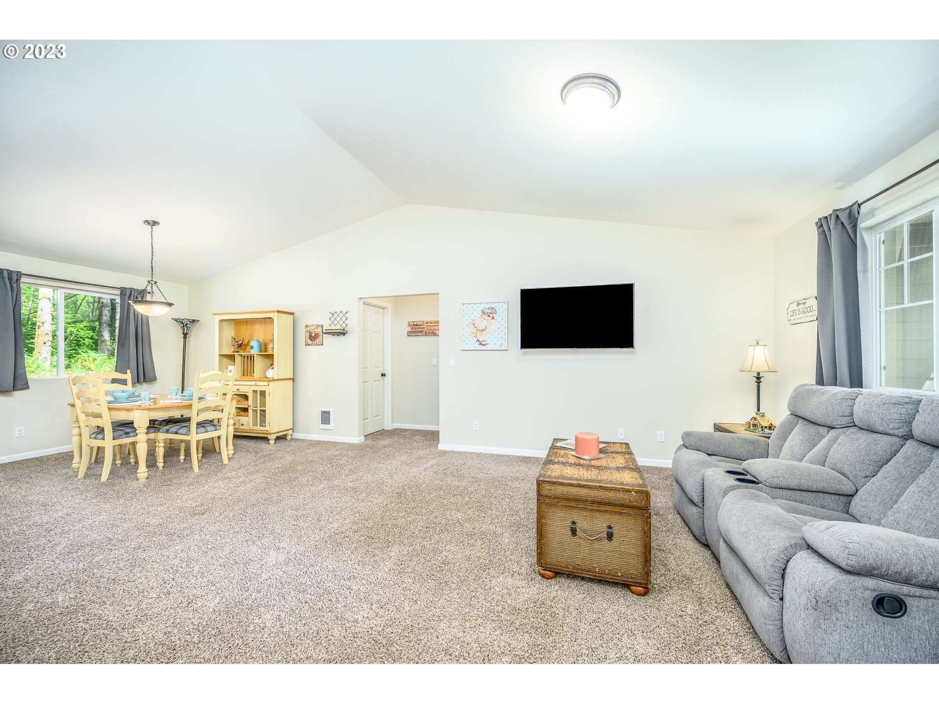 7297 Ash Street Grand Ronde, OR 97347 - Photo 4 of 33 a living room with furniture and a flat screen tv