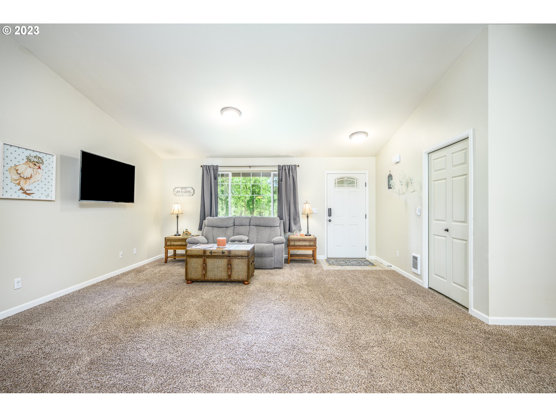 7297 Ash Street Grand Ronde, OR 97347 - Photo 5 of 33 a living room with furniture and a flat screen tv