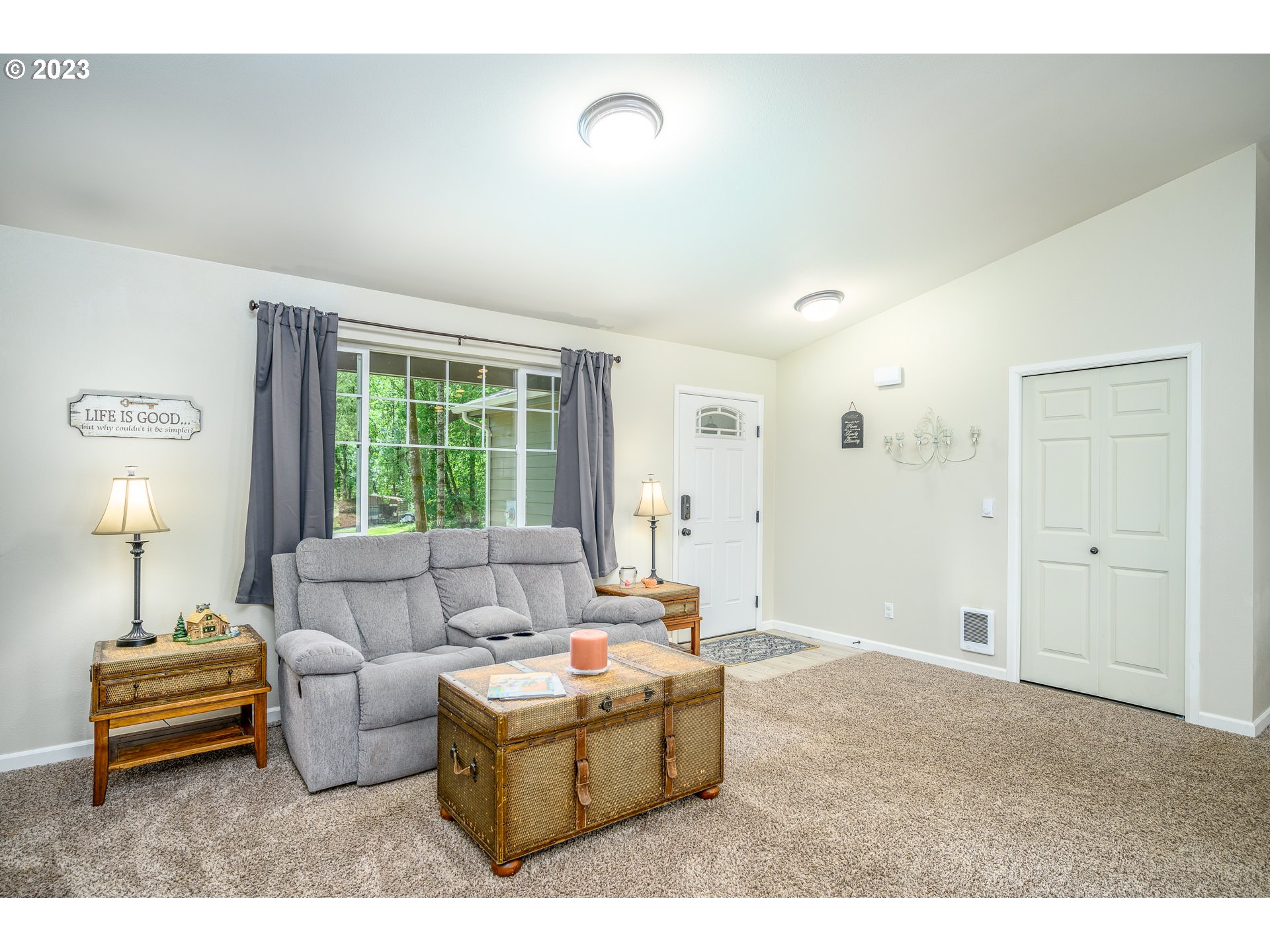 7297 Ash Street Grand Ronde, OR 97347 - Photo 7 of 33 a living room with furniture and a large window