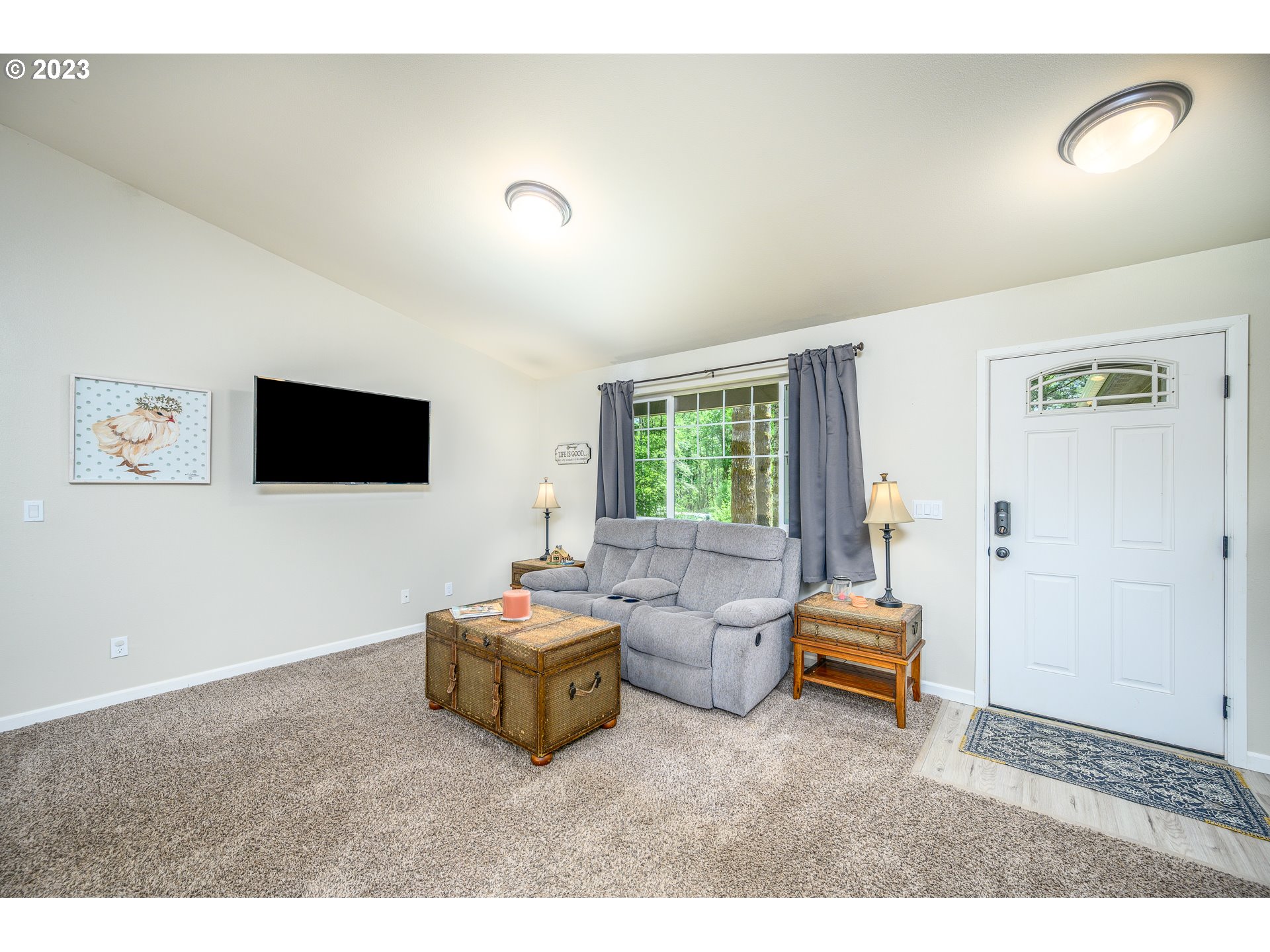 7297 Ash Street Grand Ronde, OR 97347 - Photo 8 of 33 a living room with furniture and a flat screen tv