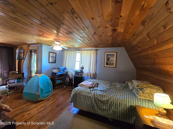 a bedroom with bed and a window