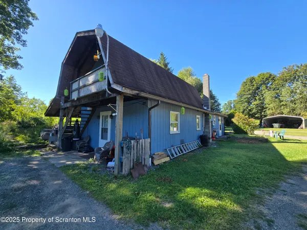 a view of a back yard of the house
