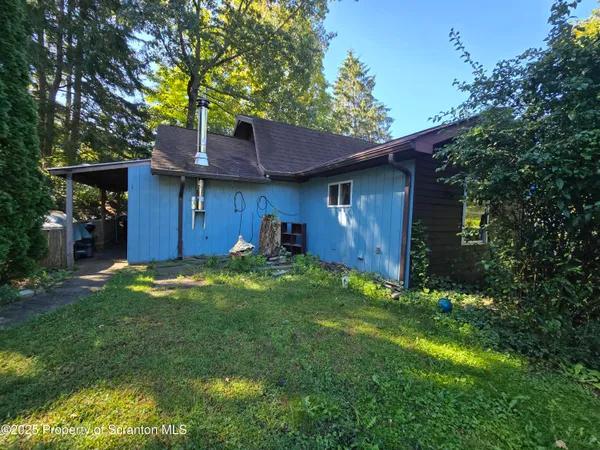 a backyard of a house with seating space