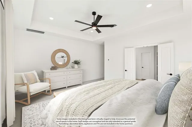 a bedroom with a bed and a couch