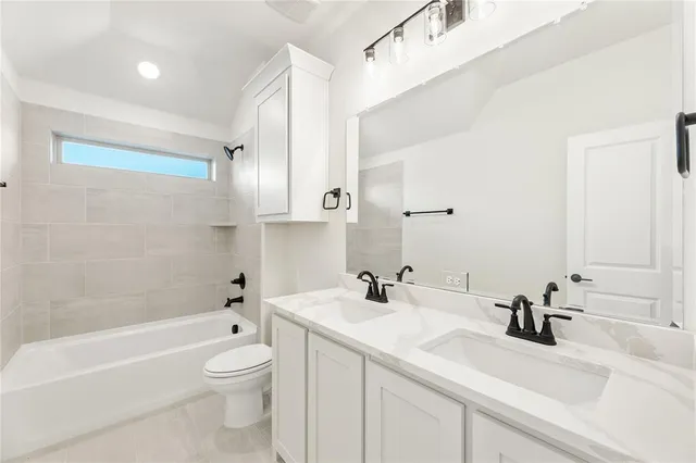 a bathroom with a sink a toilet and a bathtub
