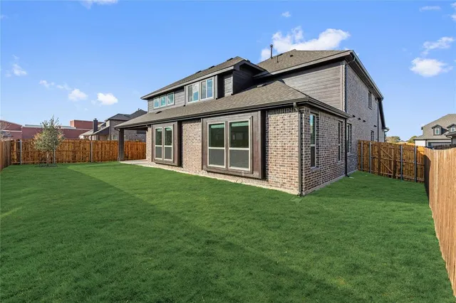 a view of a house with a big yard