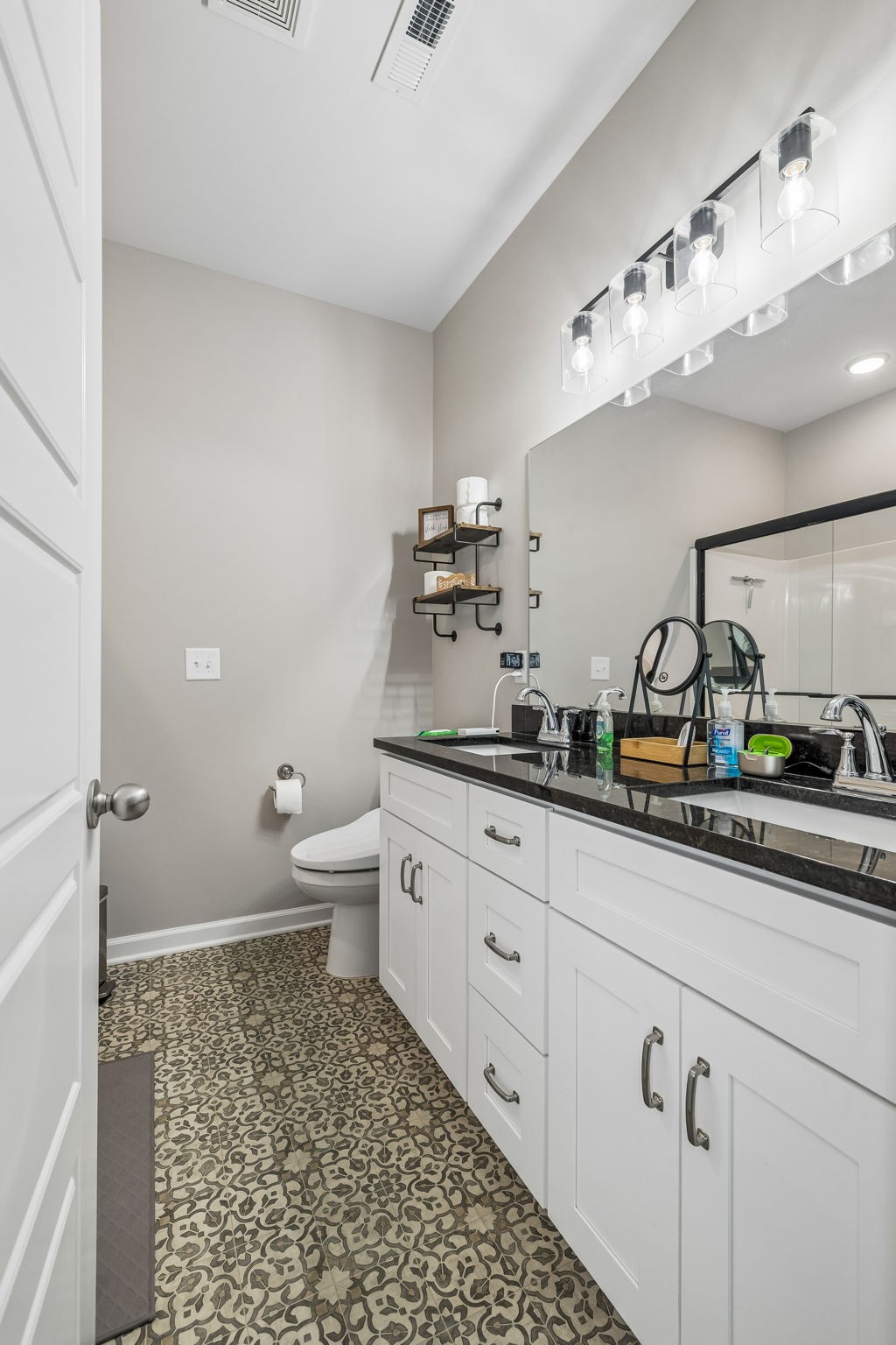180 Vickers Hill Road Smithville, TN 37166 - Photo 20 of 33 a bathroom with a sink a toilet and a mirror