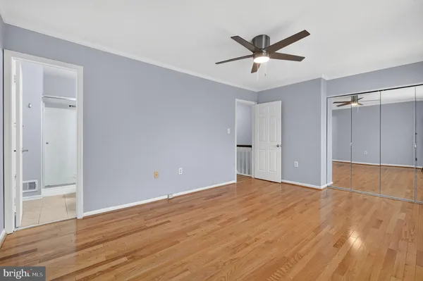 a view of room with furniture and wooden floor