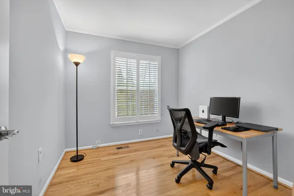 a view of an empty room with a fireplace