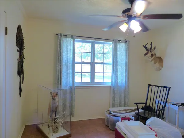a bathroom with a sink mirror and toilet