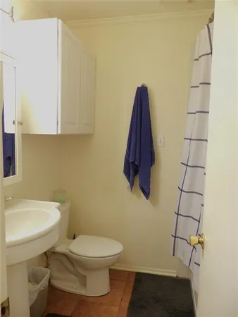 a bathroom with a toilet and a sink