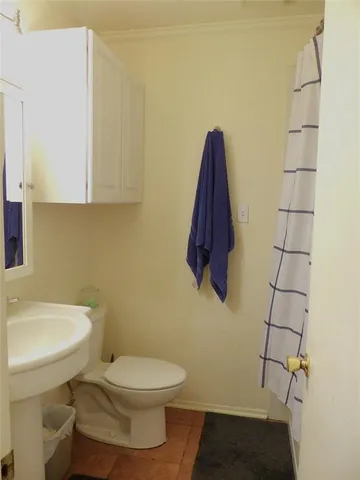 a bathroom with a toilet and a sink