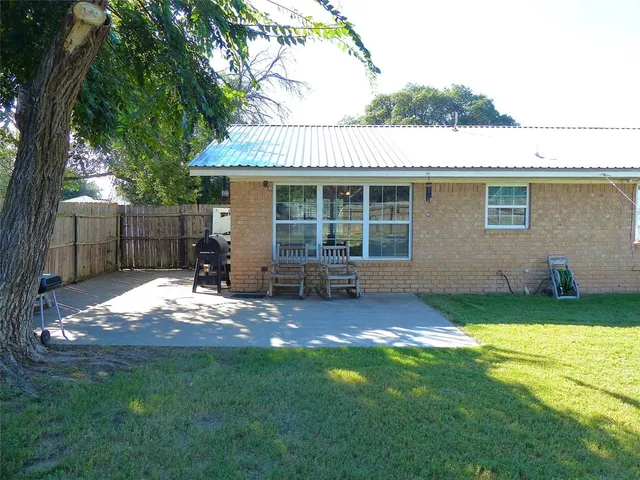 a fire hydrant in the middle of a yard