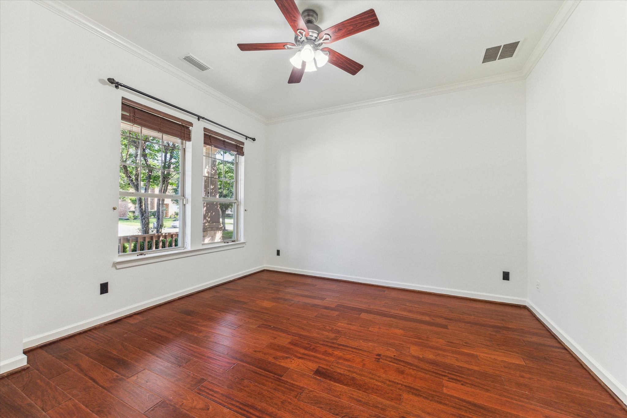 26223 Rustic Ranch Lane Katy, TX 77494 - Photo 11 of 33 wooden floor in an empty room with a window