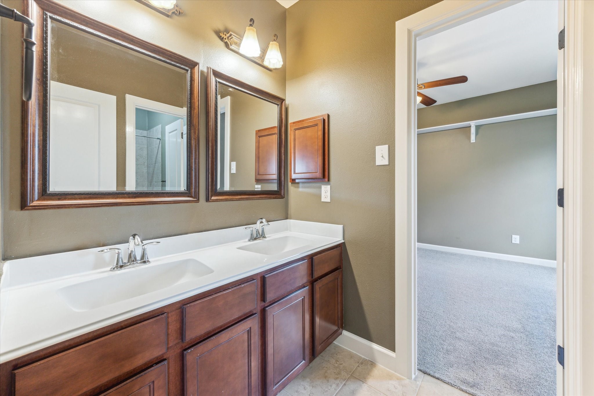 26223 Rustic Ranch Lane Katy, TX 77494 - Photo 25 of 33 a bathroom with a sink and a mirror