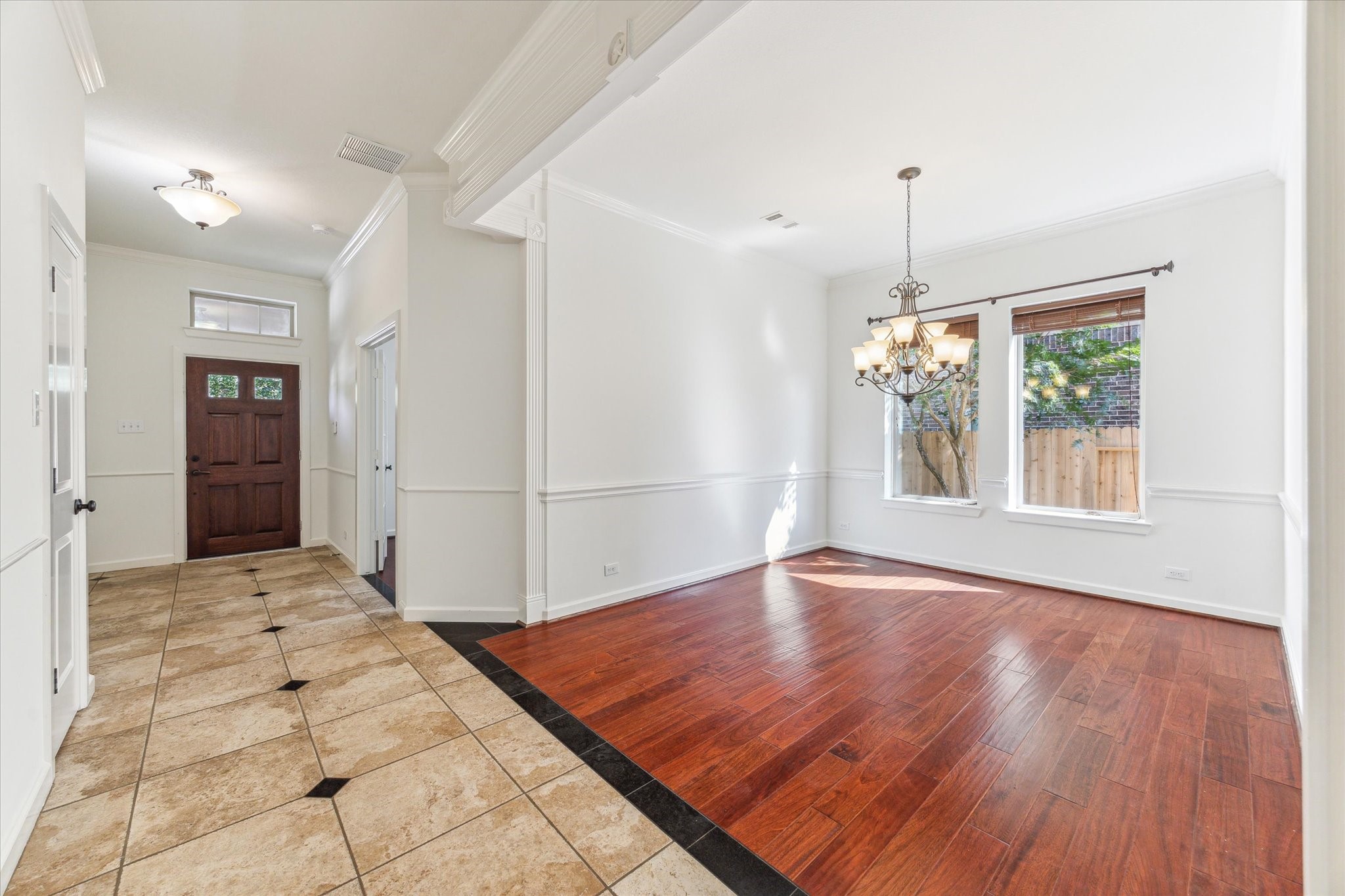 26223 Rustic Ranch Lane Katy, TX 77494 - Photo 3 of 33 a view of an empty room with window and wooden floor