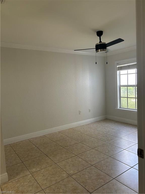14885 Pleasant Bay Lane, Unit 4104 Naples, FL 34119 - Photo 14 of 17 an empty room with a ceiling fan and a window