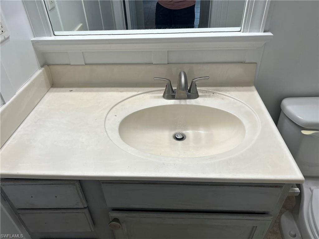 14885 Pleasant Bay Lane, Unit 4104 Naples, FL 34119 - Photo 17 of 17 a bathroom with a sink and toilet