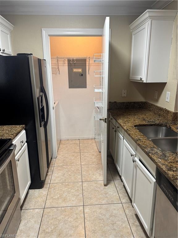 14885 Pleasant Bay Lane, Unit 4104 Naples, FL 34119 - Photo 3 of 17 a kitchen with stainless steel appliances granite countertop a refrigerator and a sink