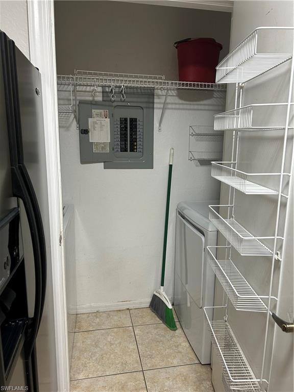 14885 Pleasant Bay Lane, Unit 4104 Naples, FL 34119 - Photo 5 of 17 a view of storage and utility room with washer and dryer