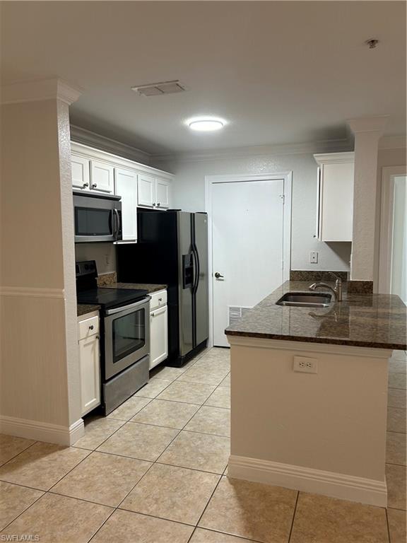 14885 Pleasant Bay Lane, Unit 4104 Naples, FL 34119 - Photo 6 of 17 a kitchen with stainless steel appliances granite countertop a stove a refrigerator and a sink