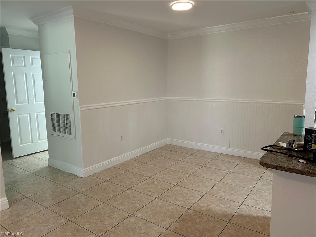 14885 Pleasant Bay Lane, Unit 4104 Naples, FL 34119 - Photo 9 of 17 an empty room with a closet