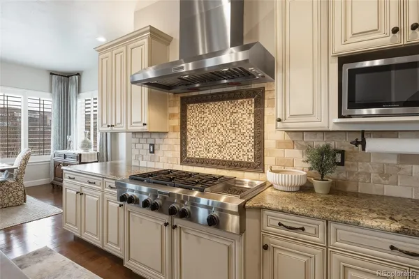 a living room with fireplace furniture and a flat screen tv