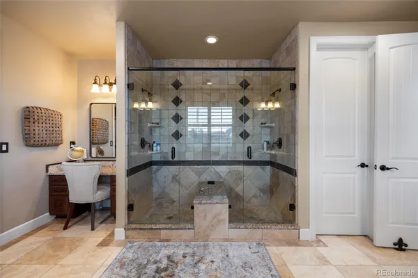 a bath tub sitting next to a bathroom and a sink