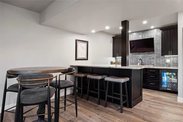 a view of a livingroom with furniture and a window