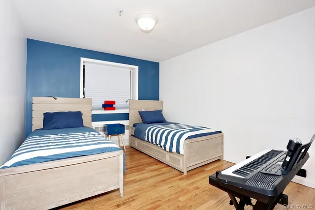 a bedroom with furniture and a window