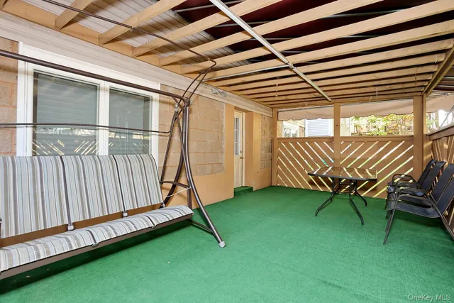 a view of a backyard with wooden fence