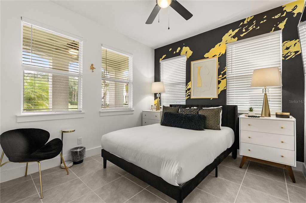7456 Gathering Drive Reunion, FL 34747 - Photo 13 of 49 a bedroom with a bed and with furniture