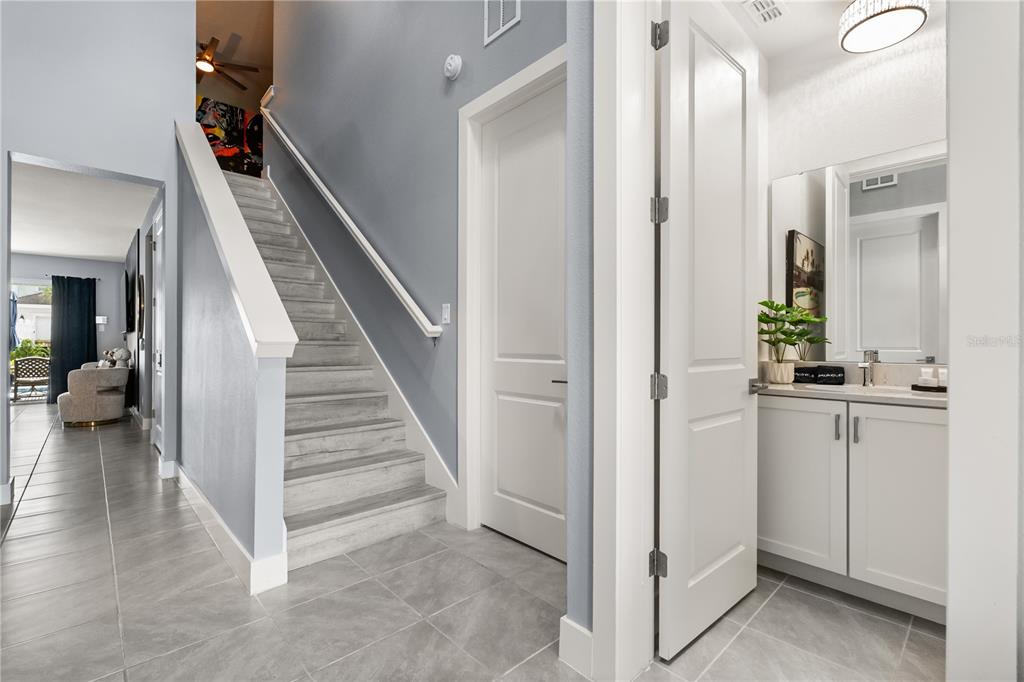 7456 Gathering Drive Reunion, FL 34747 - Photo 16 of 49 a view of a hallway with entryway and stairs