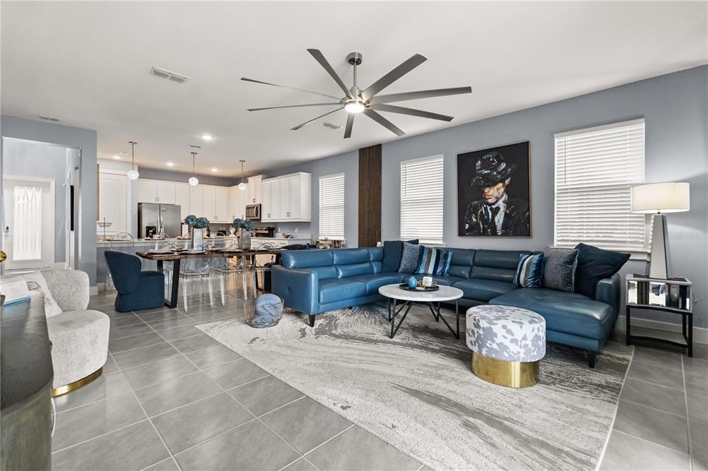 7456 Gathering Drive Reunion, FL 34747 - Photo 17 of 49 a living room with lots of furniture and view of kitchen