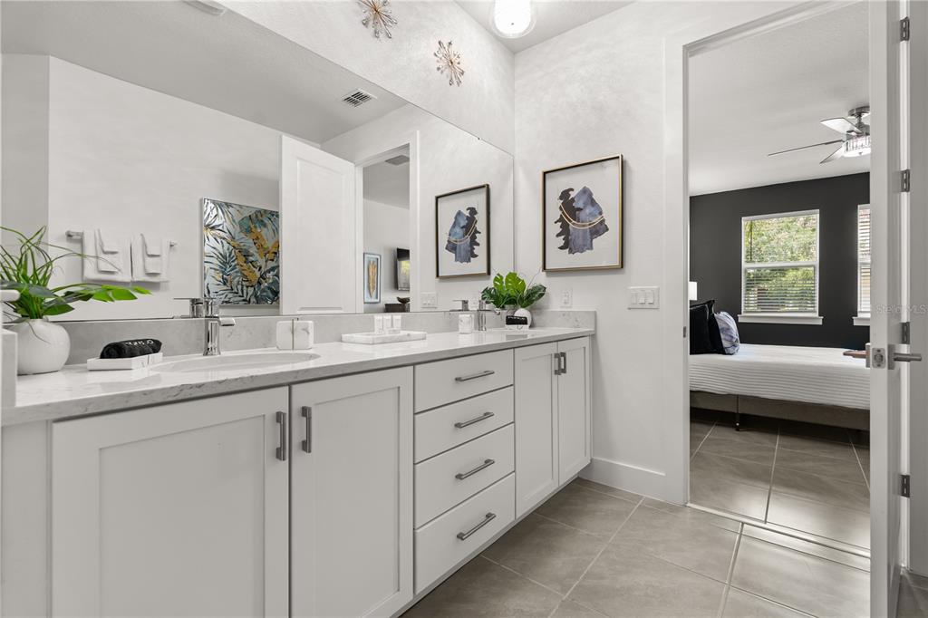 7456 Gathering Drive Reunion, FL 34747 - Photo 22 of 49 a bathroom with a sink and a mirror