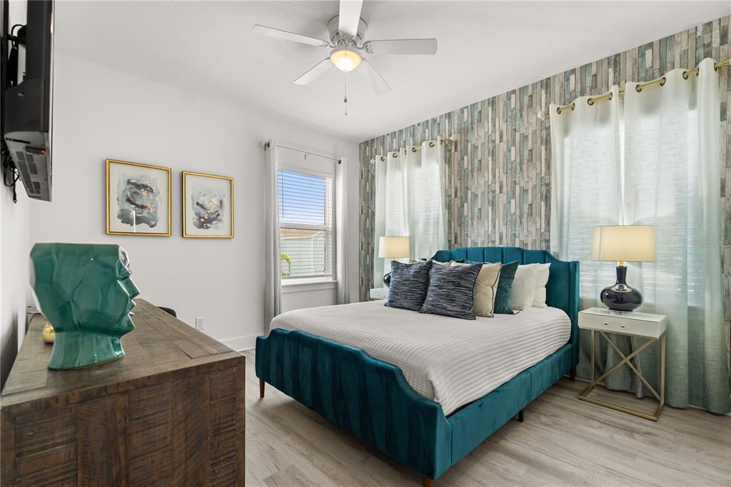 7456 Gathering Drive Reunion, FL 34747 - Photo 23 of 49 a large bedroom with a bed and window