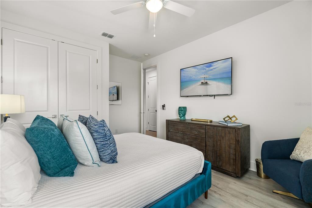 7456 Gathering Drive Reunion, FL 34747 - Photo 24 of 49 a bedroom with a bed and furniture