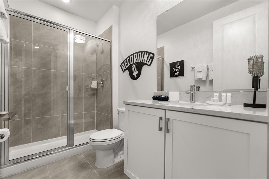 7456 Gathering Drive Reunion, FL 34747 - Photo 25 of 49 a bathroom with a toilet sink and shower