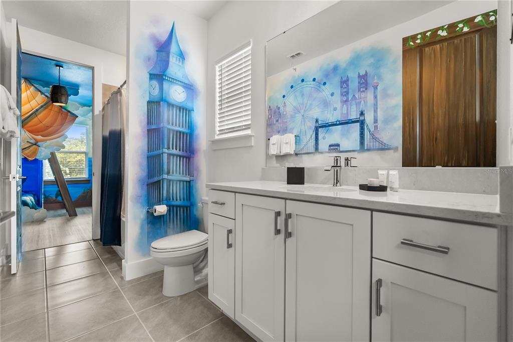 7456 Gathering Drive Reunion, FL 34747 - Photo 28 of 49 a bathroom with a sink a toilet and shower