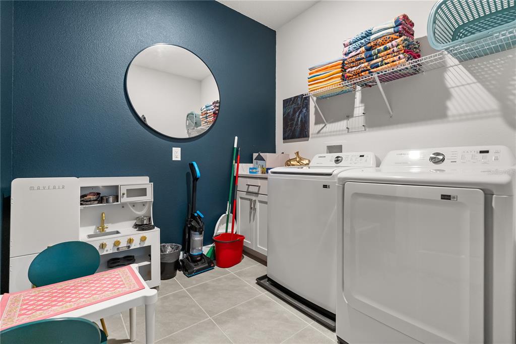 7456 Gathering Drive Reunion, FL 34747 - Photo 31 of 49 a utility room with dryer and washer