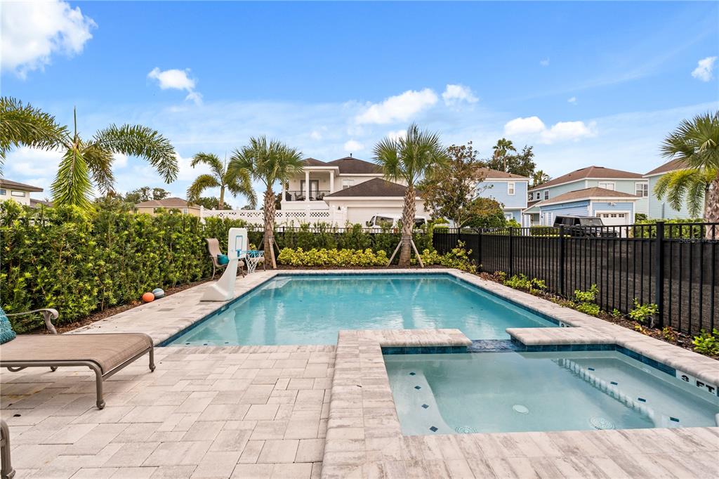 7456 Gathering Drive Reunion, FL 34747 - Photo 39 of 49 a view of a swimming pool with a lounge chairs