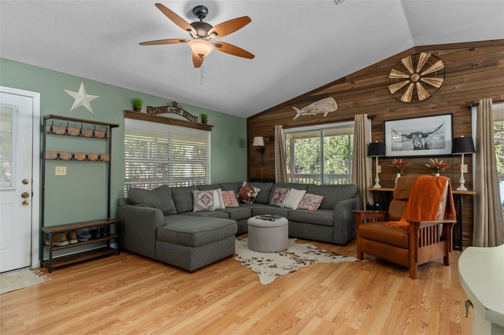 5890 South Mason Creek Road Homosassa, FL 34448 - Photo 11 of 50 a living room with furniture a ceiling fan and a window